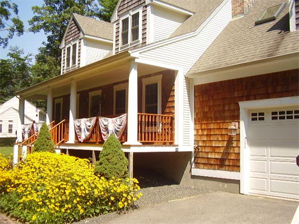 216 Brookfield Road Sturbridge, MA 01518 - Photo 18 of 18 a front view of a house with a yard