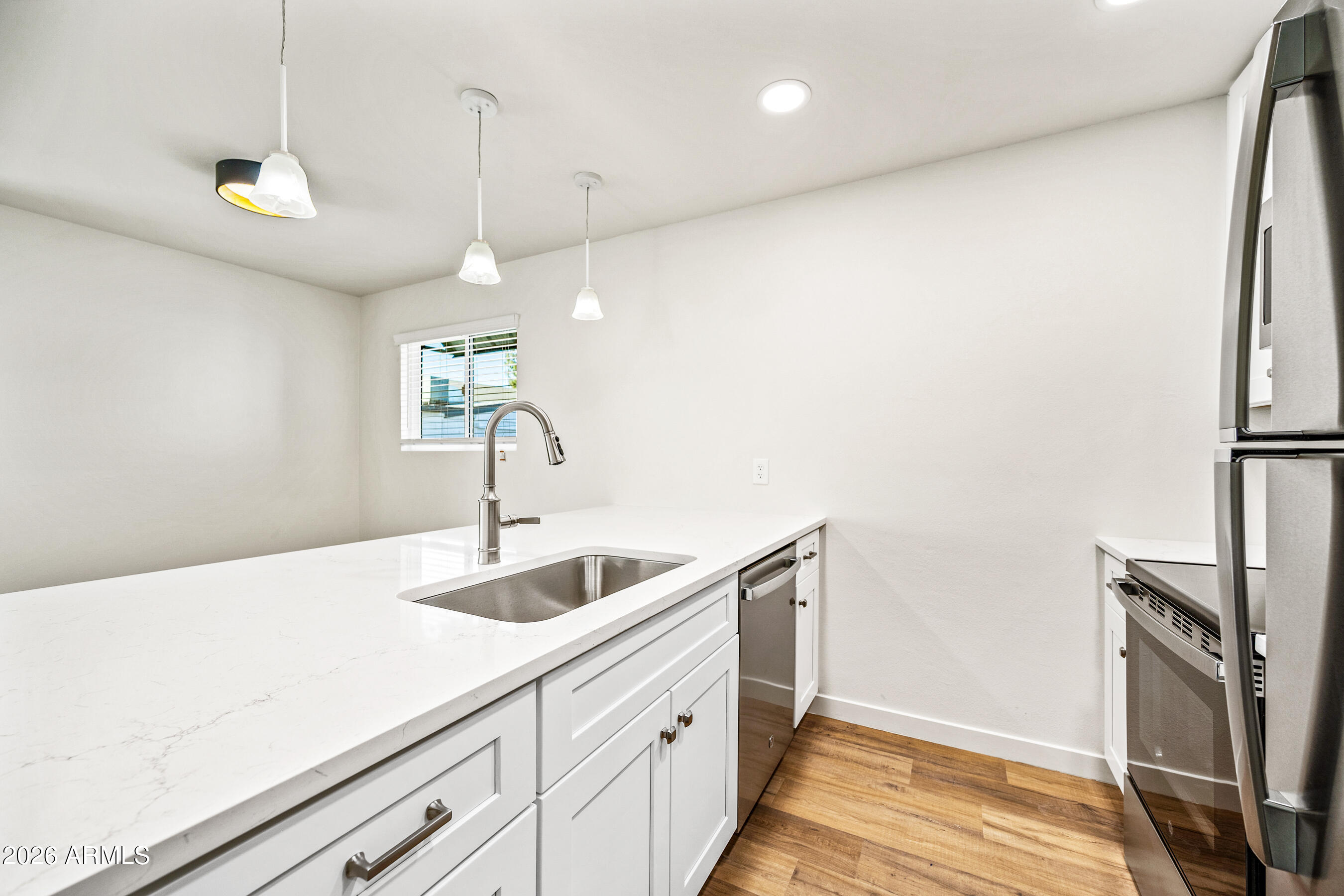 4139 North 27th Street, Unit 1 Phoenix, AZ 85016 - Photo 11 of 31 a kitchen with a sink and refrigerator