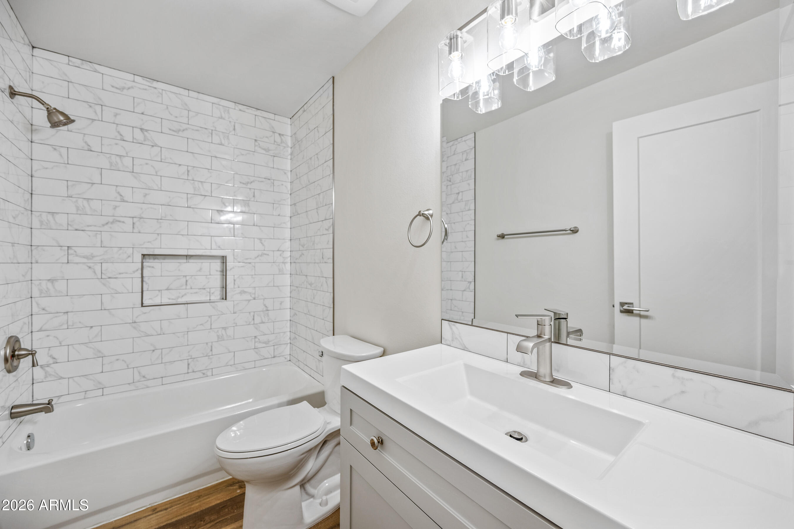 4139 North 27th Street, Unit 1 Phoenix, AZ 85016 - Photo 13 of 31 a bathroom with a sink a toilet and shower