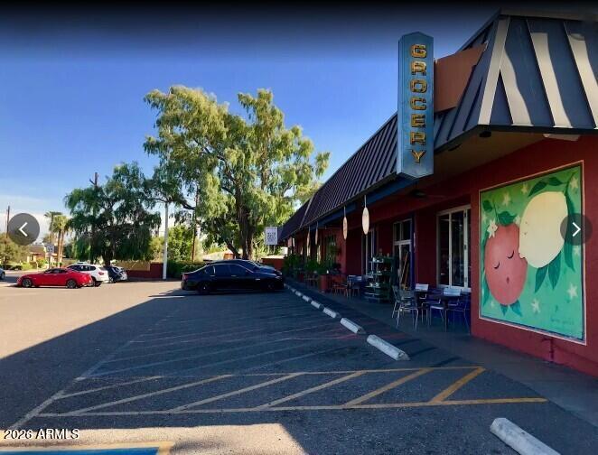 4139 North 27th Street, Unit 1 Phoenix, AZ 85016 - Photo 31 of 31 a view of a chair and tables in the patio