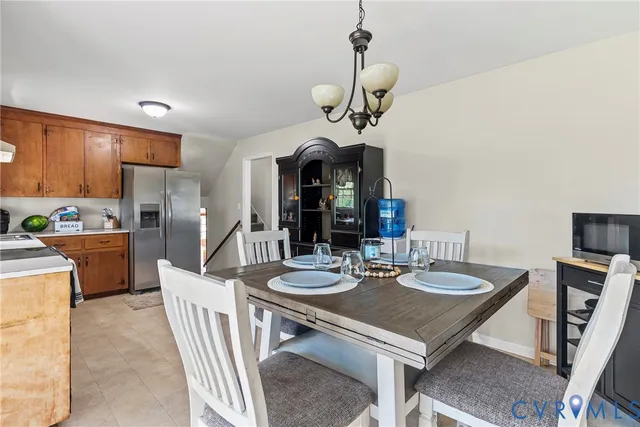 a very nice looking dining room with a table and chairs