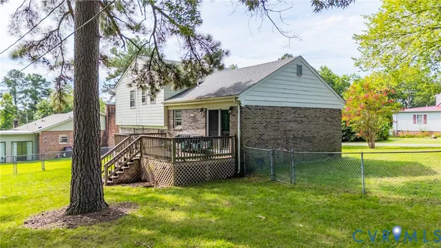 a view of a house with a yard patio and swimming pool