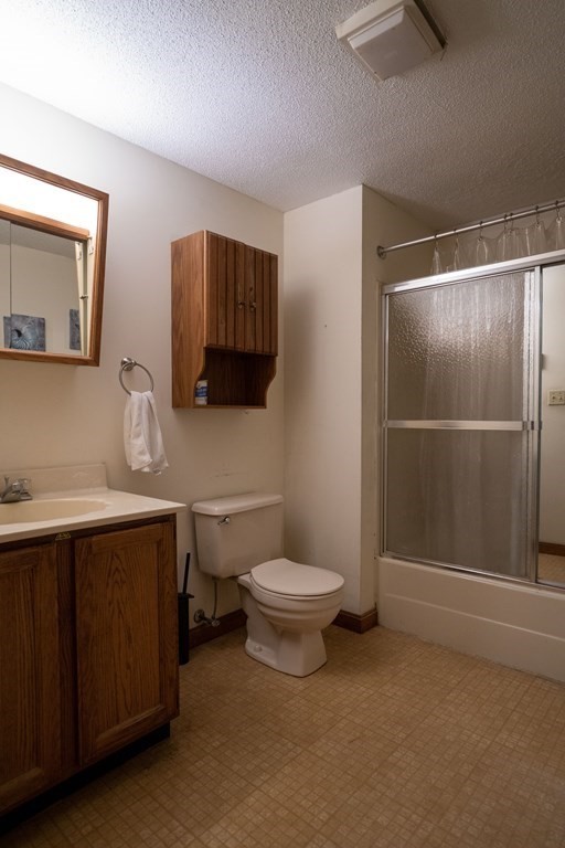 367 Bay Road Amherst, MA 01002 - Photo 13 of 27 a bathroom with a toilet a sink and mirror
