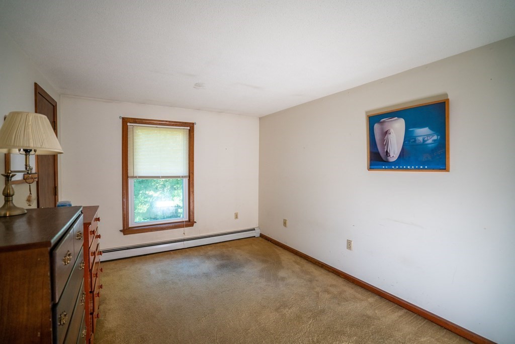 367 Bay Road Amherst, MA 01002 - Photo 20 of 27 a view of an empty room with a window