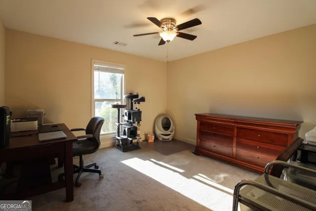 a view of a workspace with furniture