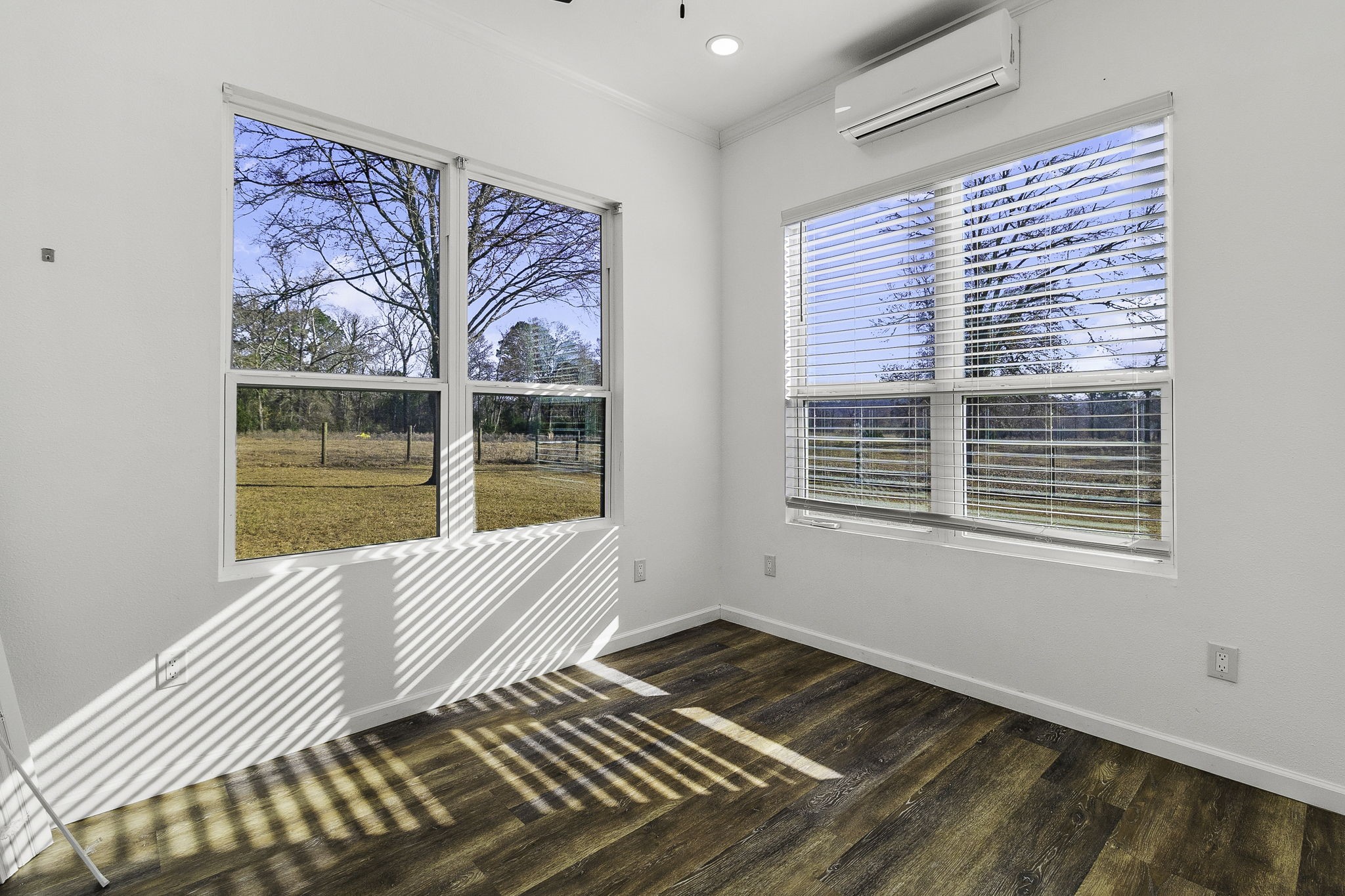 500 Highway 156 Point Blank, TX 77364 - Photo 42 of 50 a view of an empty room with wooden floor and a window