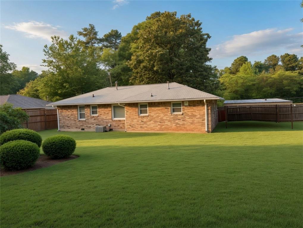 1189 Rock Cut Road Forest Park, GA 30297 - Photo 23 of 23 a front view of a house with a garden