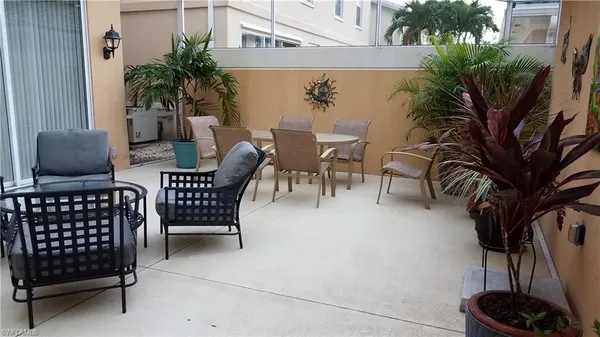 a view of a chairs and potted plant