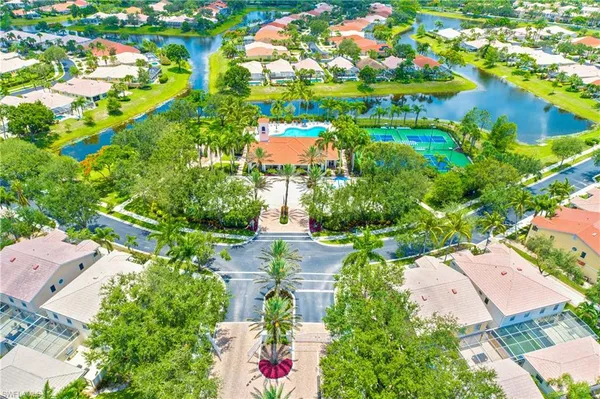 an aerial view of residential houses with outdoor space and street view