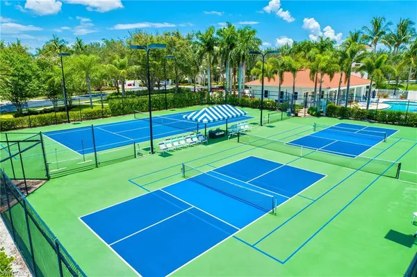 a view of an outdoor space and tennis court