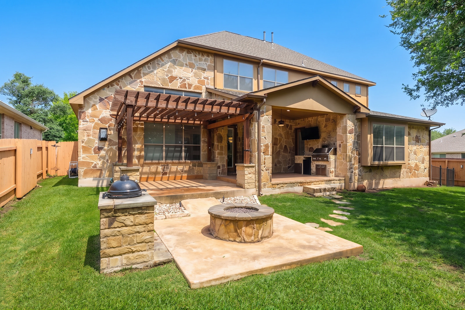 114 North Saddle Ridge Drive Cedar Park, TX 78613 - Photo 38 of 40 a front view of a house with a yard table and chairs