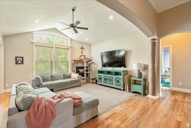 316 Azure Circle Draper, UT 84020 - Photo 12 of 48 Spacious living area featuring vaulted ceilings, a ceiling fan, recessed lighting, and large windows with an arched transom