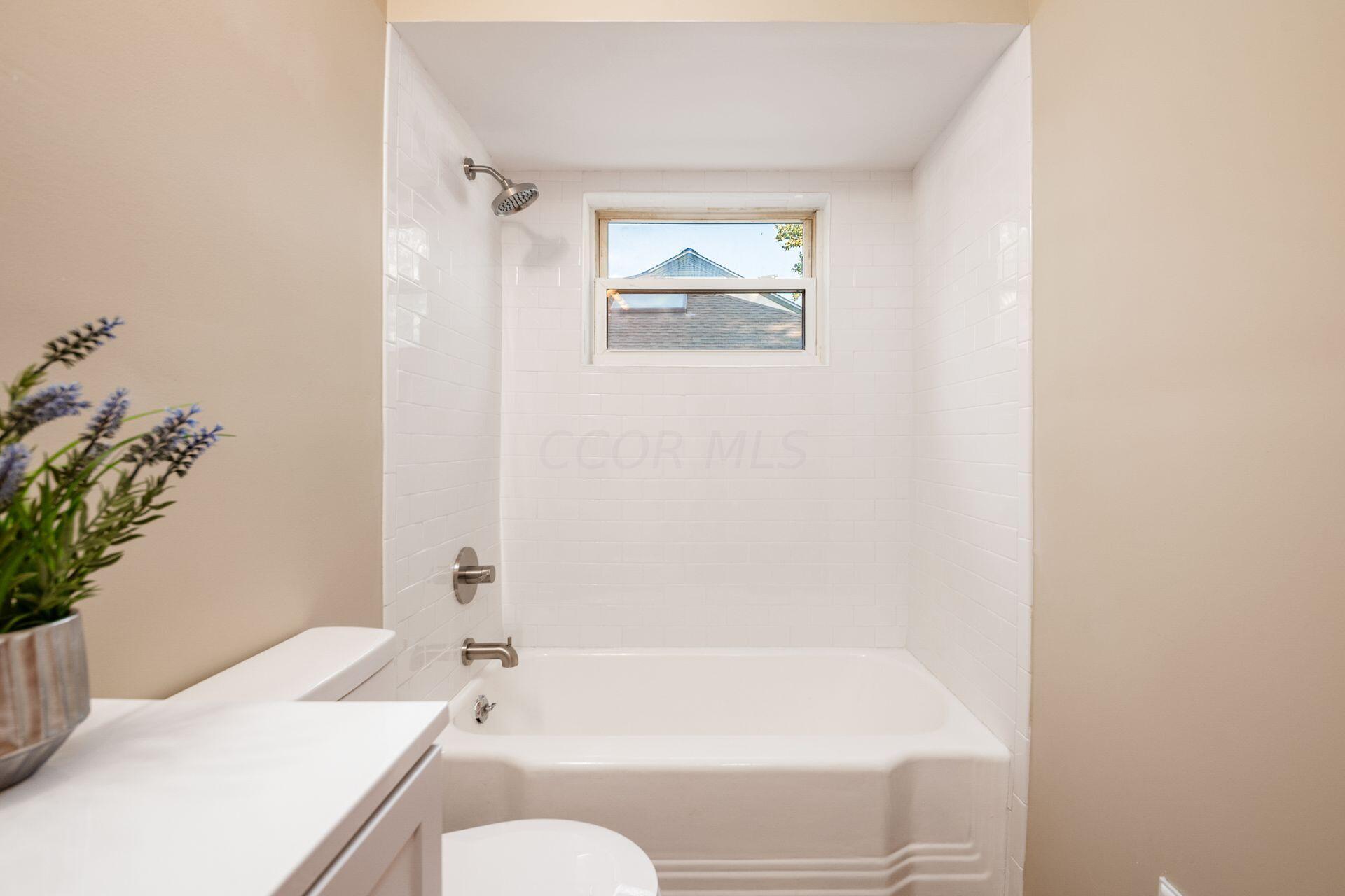 2818 Wellesley Road Columbus, OH 43209 - Photo 29 of 39 Tiled Bathtub/Shower Surround - Brushed Nickel Faucets