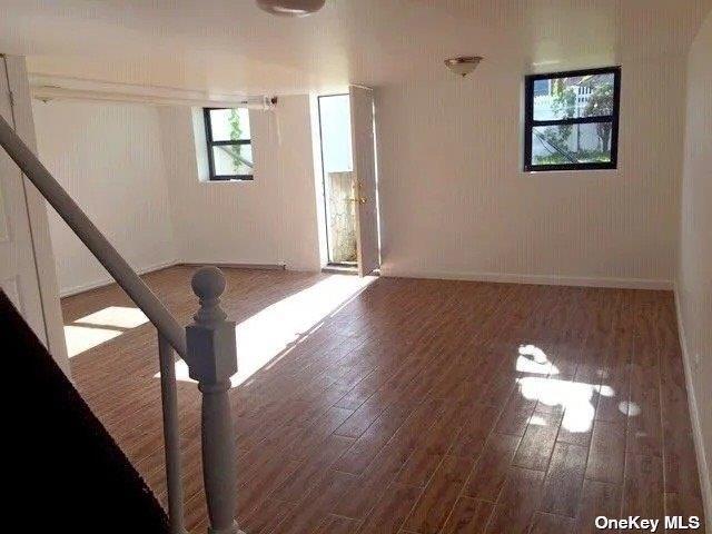 68-12 60th Road Queens, NY 11378 - Photo 3 of 7 a view of entryway and hall with wooden floor