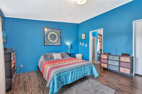 a bedroom with a bed and a dresser