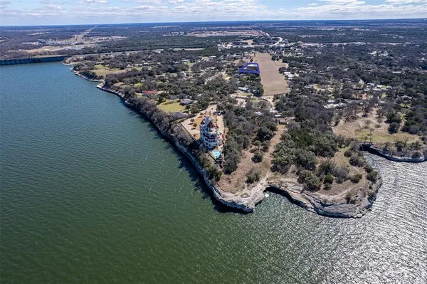 an aerial view of a house with a lake view