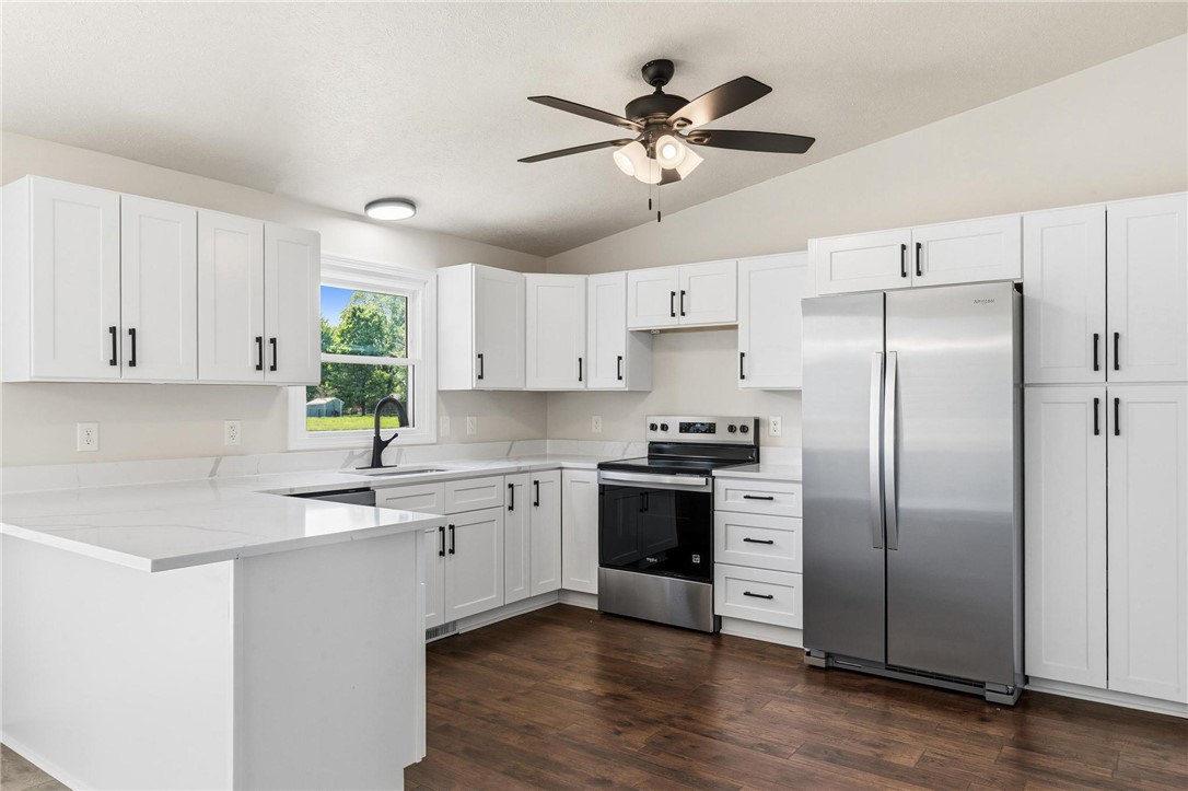 1353 Foust Road Xenia, OH 45385 - Photo 33 of 50 This newly renovated kitchen features sleek appliances and ample counter space for culinary exploration.
