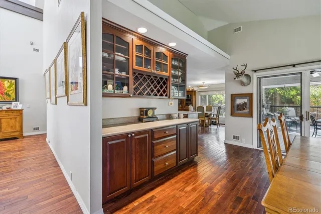 a kitchen with stainless steel appliances granite countertop a stove and wooden cabinets