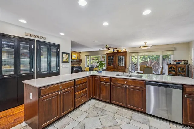 a large kitchen with lots of counter space and a sink