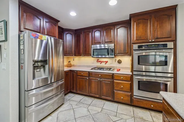 a bathroom with a shower sink and mirror
