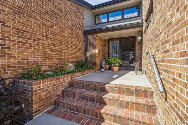 a front view of a house with outdoor seating