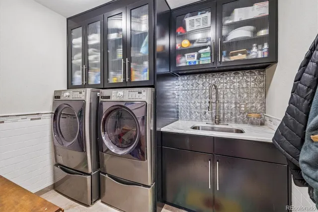 a utility room with dryer and washer