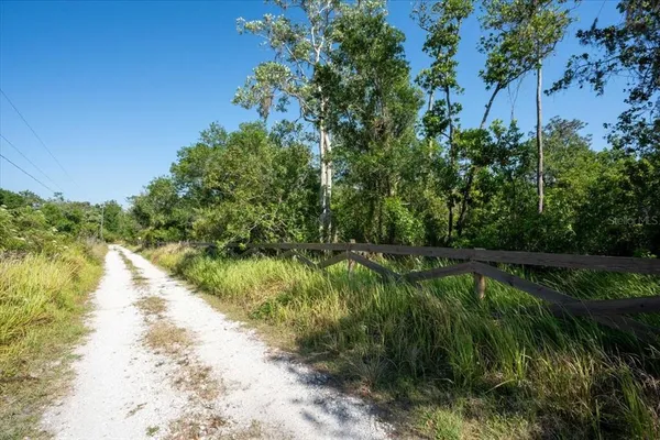 a view of a lake with a yard