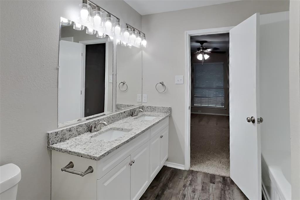 2005 Fairview Drive Forney, TX 75126 - Photo 7 of 18 a bathroom with a granite countertop sink and a mirror