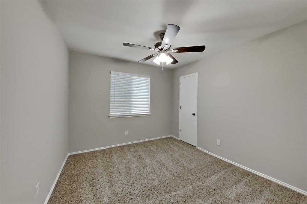 2005 Fairview Drive Forney, TX 75126 - Photo 9 of 18 a view of an empty room with a ceiling fan