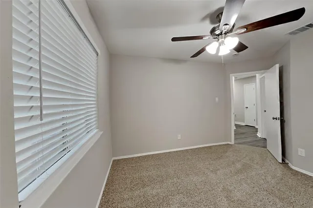 a view of a livingroom with a fan