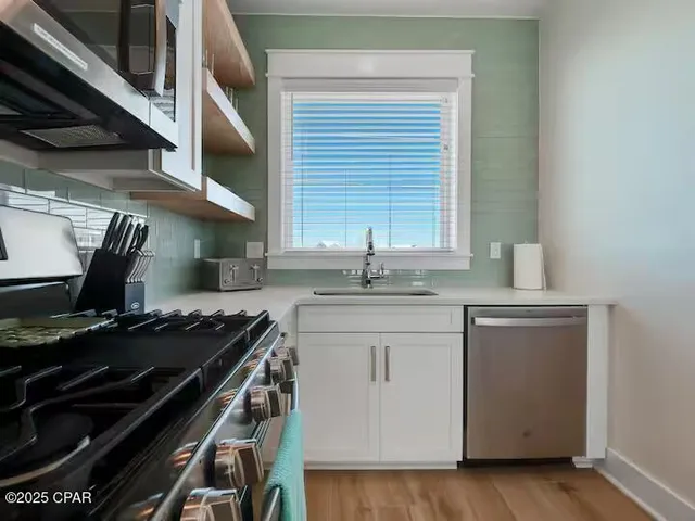 a bedroom with bed and window