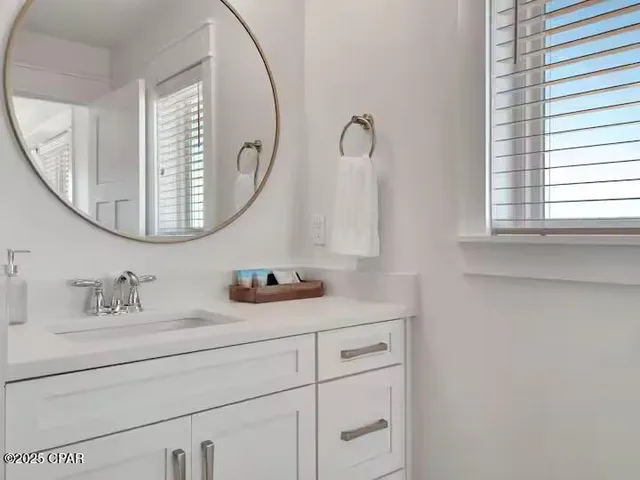 a bedroom with double bed and a window