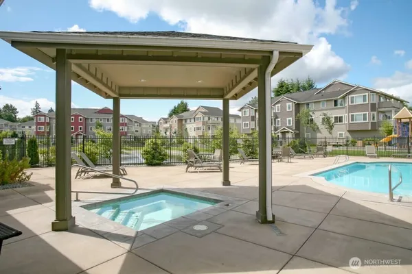 a view of swimming pool with outdoor seating