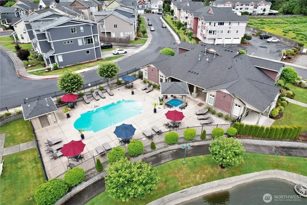 an aerial view of residential houses with outdoor space