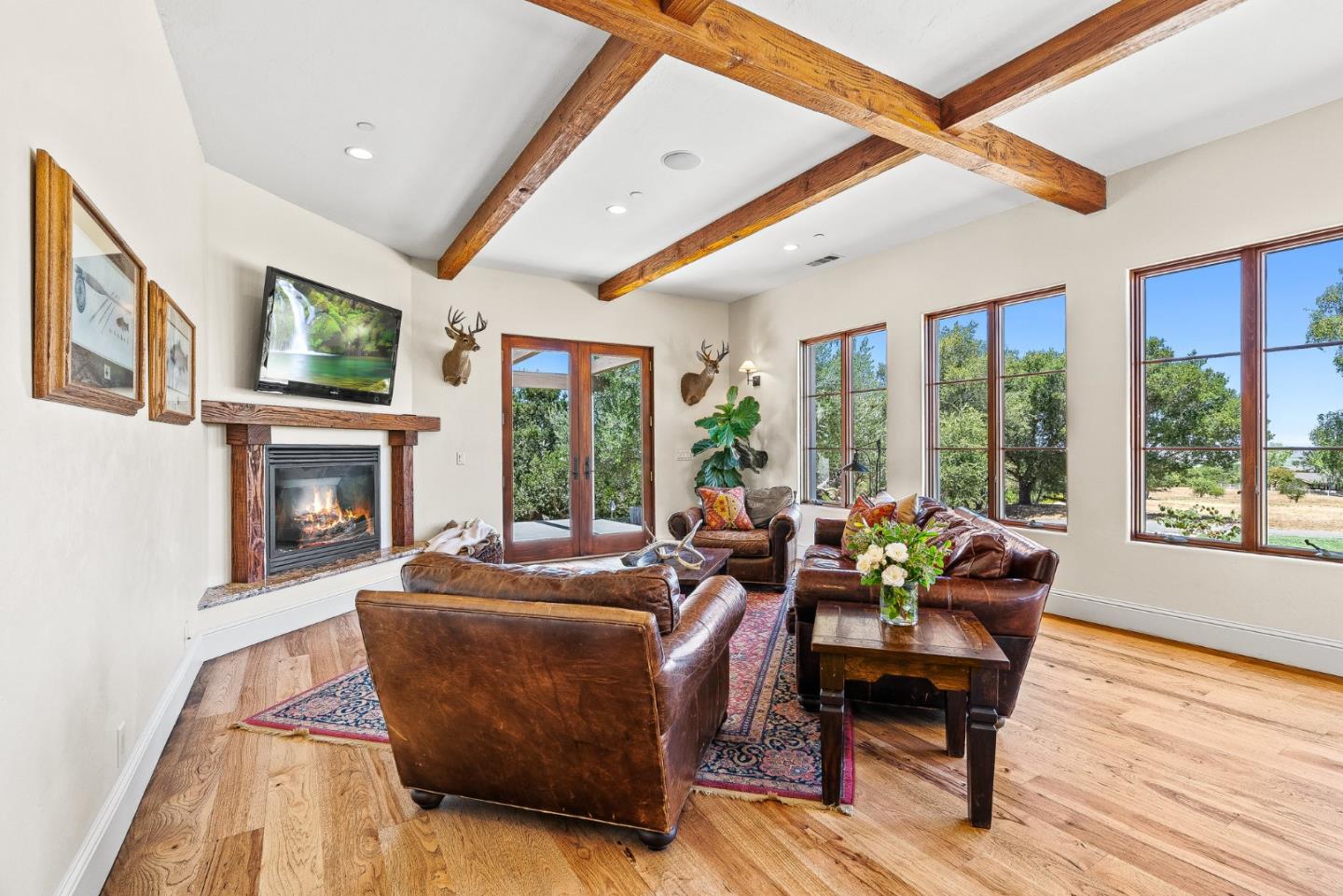 432 River Road Salinas, CA 93908 - Photo 25 of 64 a living room with furniture a fireplace and a floor to ceiling window