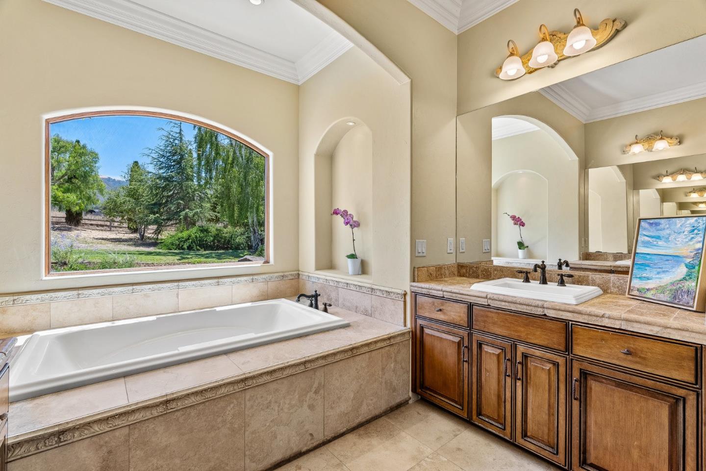 432 River Road Salinas, CA 93908 - Photo 31 of 64 a bathroom with a double vanity sink a large mirror and a bathtub