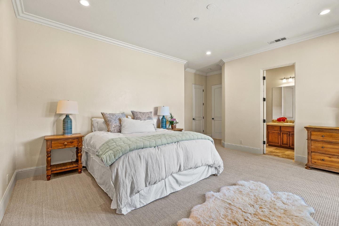 432 River Road Salinas, CA 93908 - Photo 37 of 64 a spacious bedroom with a bed and a lamp