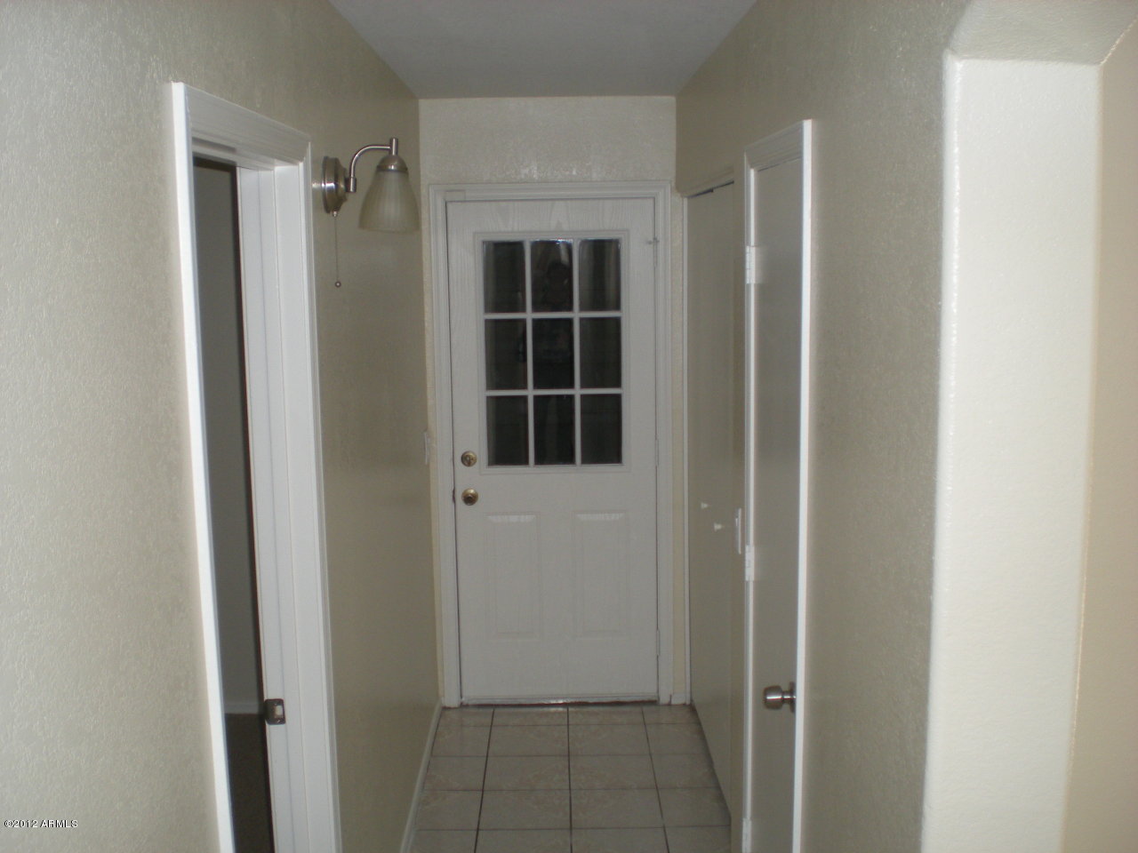 8656 West Monte Vista Road Phoenix, AZ 85037 - Photo 5 of 6 Leads to Garage