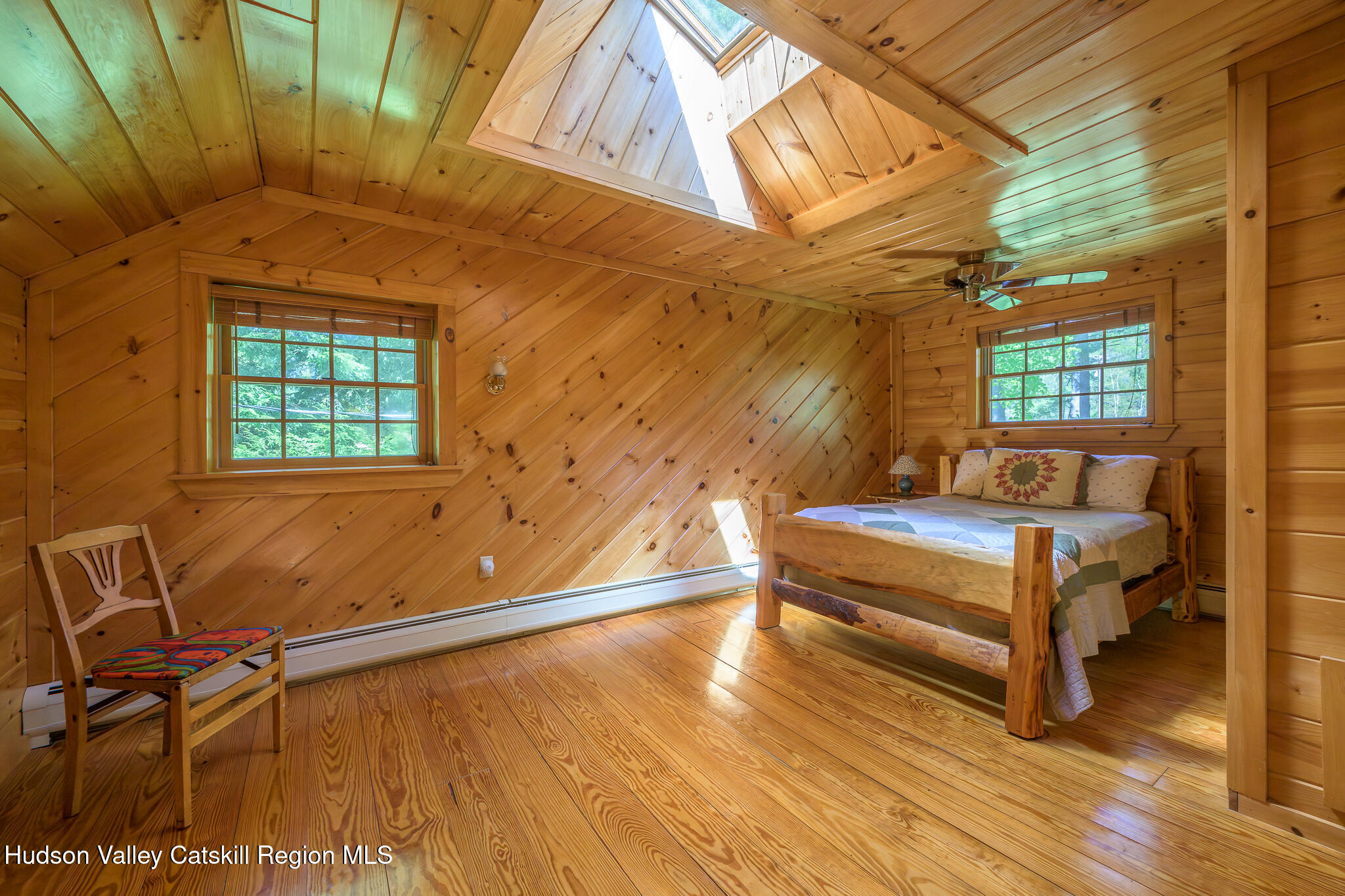 34 Queechy Shore Beach Road Canaan, NY 12029 - Photo 20 of 31 a bedroom with a bed and wooden floor