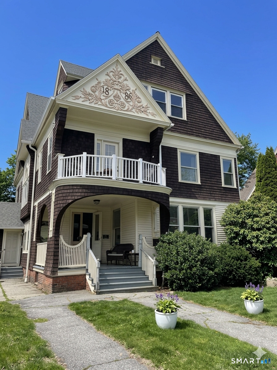 51 Broad Street, Unit 2A Norwich, CT 06360 - Photo 1 of 1 a front view of a house with garden