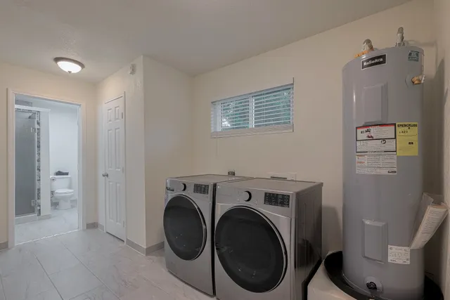 a view of a storage & utility room with washer and dryer