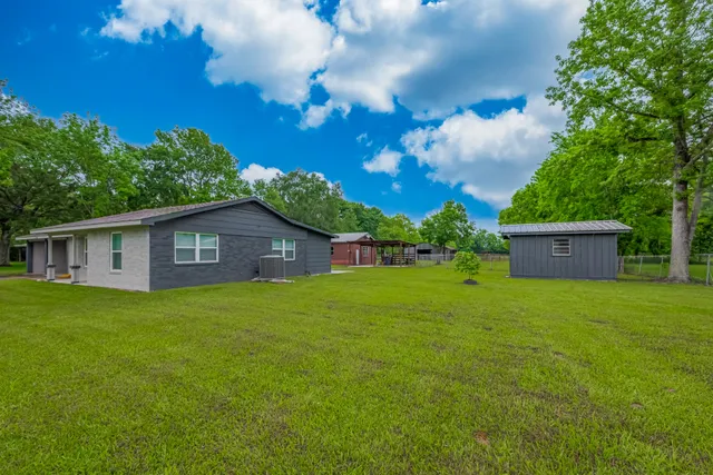 a view of a tiny house with a yard