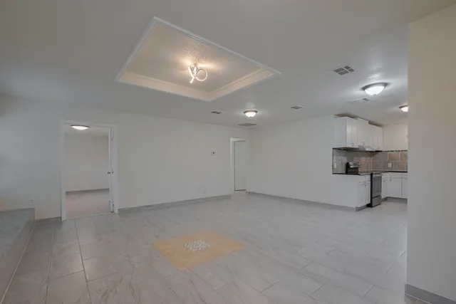 an empty room with a projector and a lamp