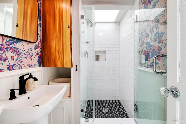 a bathroom with a sink and a shower curtain