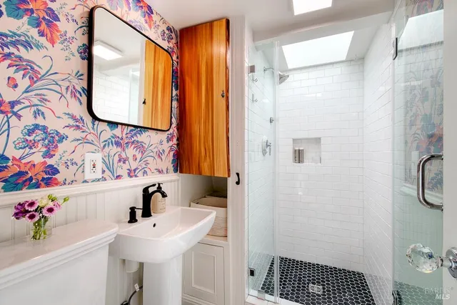 a bathroom with a sink and a mirror