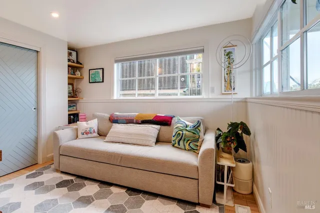 a living room with furniture and a window