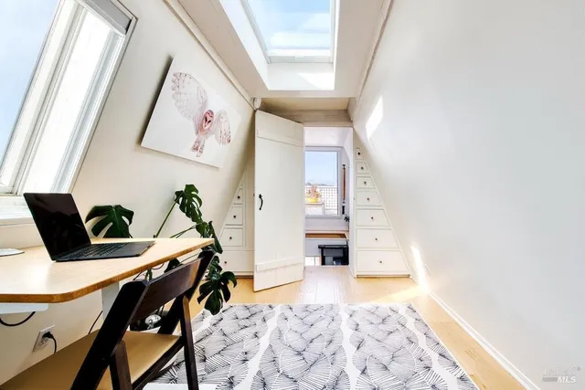 a view of workspace with furniture and window