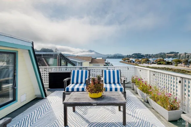 a view of a balcony and chairs