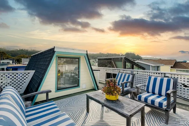 a view of a roof deck with couches
