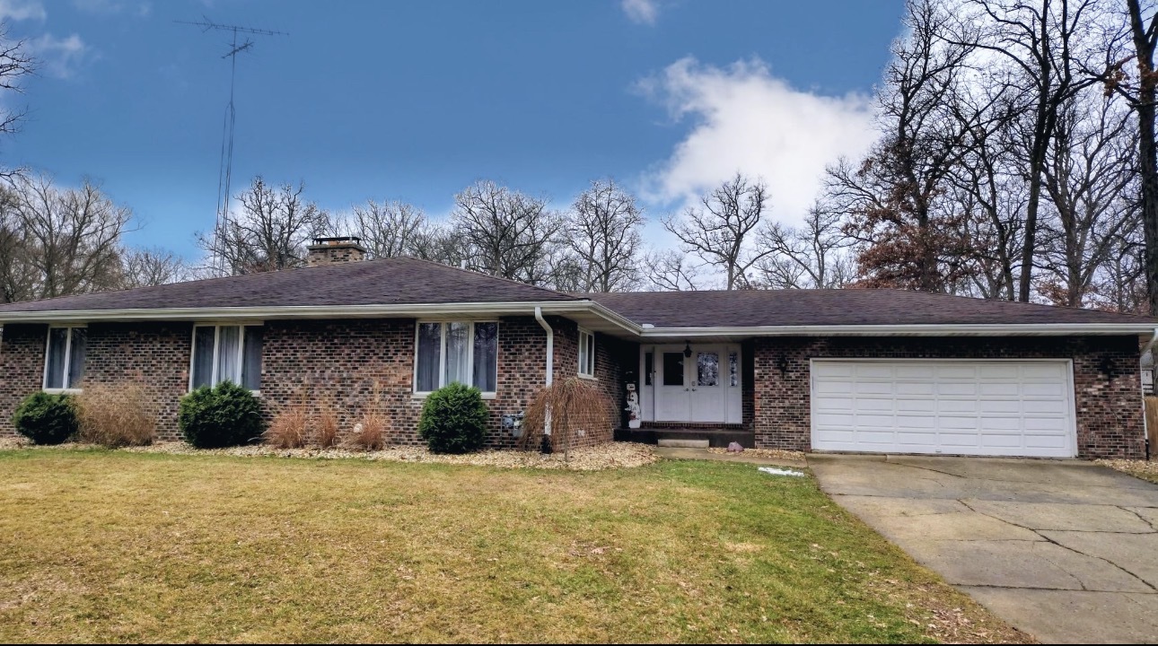 13570 Base Line Road Kingston, IL 60145 - Photo 2 of 3 a front view of a house with garden